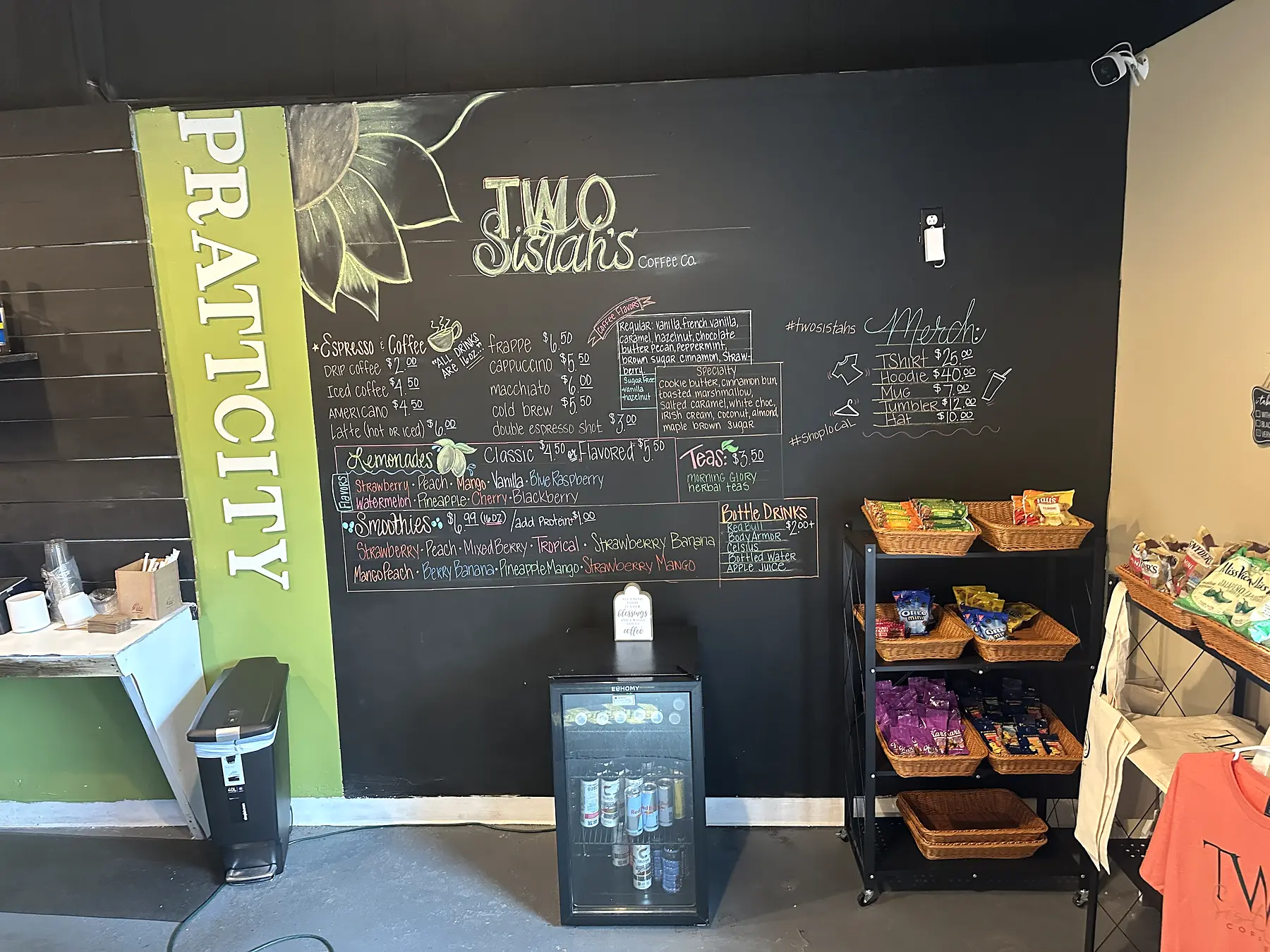 Two Sistas menu wall and café interior